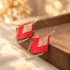 Aretes Geométricos Rojos Ankela Festivos de Año Nuevo Nicho Temperamento Venta Caliente Aretes de Botón Otoño/Invierno 2026 Venta al por Mayor de Pendientes
