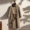 Casaco de lã feminino 2026 novo estilo outono e inverno, abotoado com bolsos, comprimento médio, estilo Hepburn, casaco de cashmere dupla face