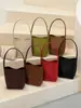 Bolso de hombro de color liso con patrón tejido, de alta calidad, retro, moderno, bolso tipo cubo casual simple y único para el día a día.
