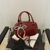 Bolso de Mano Cuadrado Pequeño de Moda al por Mayor para Mujer Verano 2025 Nuevo Estilo Bolso de Hombro con Lazo de Perla Bolso Cruzado de Moda