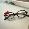 Subcultura Hello Kitty Laço em Armação Oval Preta Estampa de Leopardo Lentes Planas Rosto Limpo Venda Direta de Fábrica
