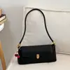 Bolsa Pequena de Axila Francesa de Luxo Leve Transfronteiriça Nova Moda Feminina Nicho Bolsa Baguete de Mão Bolsa de Ombro Único de Alta Qualidade Tendência