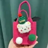 Bolsa de fieltro de manzana para Navidad Bolsa de regalo de fieltro para Nochebuena para novia bolsa de regalo de fieltro fabricantes