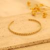 Venta caliente transfronteriza diseño de nicho de oro de 18 quilates joya de mano ins pulsera abierta de acero inoxidable plano trenzado francés venta al por mayor