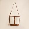 Nuevo bolso de cubo de lona diseño nicho combinación de colores de alta gama bolso de hombro moda commuter gran capacidad bolso bandolera