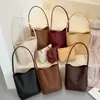 Bolso de axila vintage de alta gama coreano para mujer, verano 2026, cuero suave tejido, bolso de hombro casual tipo cesta