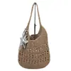 Bolso de paja nuevo de gran capacidad, bolso de hombro tejido casual estilo coreano calado, bolso versátil para mujer, bolso de playa para vacaciones junto al mar