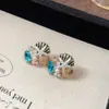 Pendientes geométricos de perlas y circonitas transfronterizos europeos y americanos, pendientes exquisitos de nicho de lujo ligero de alta gama, accesorios para orejas simples y elegantes para mujer