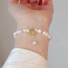 Pulsera de perlas de agua dulce naturales estilo Little Red Book Pulsera de alta gama para niñas Nueva joya de mano de alta gama al por mayor