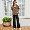 Moda solta Street hipster feminina bainha dividida casual camiseta gola redonda manga curta de um botão estampado top