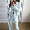 Conjunto de pijama outono/inverno novo, estilo europeu e americano, com blocos de cor amarelo cremoso, mangas compridas e calças compridas, adequado para usar ao ar livre, conjunto exclusivo para casa de comércio exterior 2026