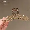 Moderna Elegante de Gama Alta Clip de Garra de Cristal Amarillo Nuevo Estilo Celebridad de Internet Clip para Moño en la Parte Trasera de la Cabeza Muestra Volumen del Cabello Clip de Tiburón