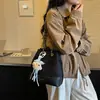 Bolso de cubo de cadena con patrón de diamantes versátil de nicho de moda retro coreana 2026 nuevo modelo bolso de hombro cruzado de alta gama
