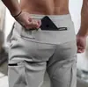 Hermanos Fitness Muscular Pantalones Deportivos de Ocio para Hombre Primavera y Otoño Correr Ejercicio Pantalones con Múltiples Bolsillos Pantalones de Chándal Comercio Exterior Venta al por Mayor Transfronteriza