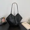 Textura retrô padrão trançado feminino 2026 letra novo estilo moderno para ir ao trabalho casual bolsa de ombro única de grande capacidade bolsa tote