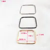 Accesorios de Hardware para Asas de Bolsas de Guangzhou Anilla de Tirador Metálica Semi-Circular Trapezoide Redonda con Forma de Cabeza de Gato