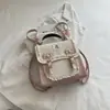 Bolsa de Ombro Dupla Doce Exquisita Super Popular de Nicho Feminina 2026 Nova Mini Versátil para o Dia a Dia Mochila Transversal Pequena Bolsa Escolar