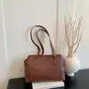 Otoño 2026 Nuevo Estilo Coreano Moderno y Elegante Bolso Sencillo para el Hombro Color Sólido Bolso de Hombro para Viajes Cotidianos Retro al por Mayor Bolso para Mujer