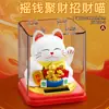 Una figura de gato en busca de fortuna, un nuevo producto diseñado para atraer riqueza, con movimiento automático alimentado por energía solar, perfecta para decorar escritorios y tiendas, añadiendo un toque de elegancia
