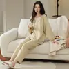 Pijamas de forro polar al por mayor listos para enviar para mujer, conjunto de invierno de manga larga y pantalón largo, forro polar de seda y lana, transmisión en vivo, ropa de casa transfronteriza para mujer