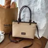 Bolsa de Cubo de Agua Portátil de Gran Capacidad Shuai Mijia para Mujer 2026 Otoño Nuevo Estilo Lujo Ligero Nicho para Viajes de Trabajo Alta Calidad Bolso de Hombro Único