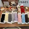 Nuevo y popular juego de calcetines estilo miu para mujer, otoño e invierno, engrosado con lana de oveja para abrigar, con diseño de volantes y color liso, calcetines hasta la pantorrilla