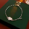Pulseira de cerâmica com contas galvanizadas a ouro real, estilo nacional, retrô, elegante, pulseira de nicho, joker de alta qualidade, atacado, feminina