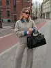 Conjunto de punto patchwork con cuello de mezclilla retro europeo y americano, nuevo suéter casual holgado y pantalones para mujer, conjunto de dos piezas