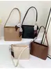 Bolso de mujer único y elegante, nuevo modelo otoño e invierno 2026, estilo de Hong Kong de moda, bolso de mujer con temperamento vintage, bolso de hombro, bolso de axila, bolso tipo cubo