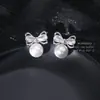 Aretes de Perla con Moño Incrustado de Circonita Estilo Coreano Nuevo Estilo Pendientes de Venta Caliente Diseño de Nicho Pendiente Versátil de Gama Alta