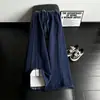Pantalones de chándal de cuadros patchwork deconstruidos negros para hombre, marca de tendencia de otoño, pantalones rectos de alta gama que estilizan, pantalones de microcampana estilo americano