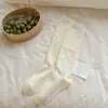 Calcetines de ternera blancos lechosos con borde de volantes para mujer, calcetines largos apilables de primavera y otoño con encaje hueco, calcetines altos JK sin costuras