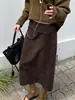 Falda de ante sintético de cintura alta con doble bolsillo falso, nueva colección otoño/invierno 2026, estilo retro europeo y americano transfronterizo, marrón oscuro, falda midi de corte recto