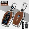 Adecuado para carcasa de llave LCD BMW Serie 7 740 piel genuina Serie 5 pantalla LCD X5X7 masculino X6 hebilla de concha bolsa fabricante de origen