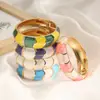 Bestseller transfronteiriço na Europa e América: Pulseira de design irregular em blocos de cores esmaltadas retrô criativas com design de bambu ondulado boêmio