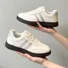 Zapatillas de entrenamiento alemanas estilo coreano para niños, colección primavera/otoño 2026, zapatillas casuales versátiles para niñas, cómodas zapatillas blancas estilo coreano para niños de mediana y mayor edad