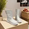 Nuevas botas de cuero suave de invierno 2026, botas Martin de suela plana, populares botas de nieve de cuero para mujer, botines cortos forrados de felpa y engrosados para mujer