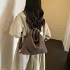 Bolso tote texturizado vintage de alta gama para mujer, nuevo modelo 2026, bolso de hombro casual simple, mochila versátil y elegante