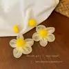 Brincos elegantes e versáteis, com um toque de fada e acabamento de alta qualidade, perfeitos para férias à beira-mar, brincos florais deslumbrantes, atacado