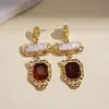 Pendientes de borla con carcasa de madera marrón transfronterizos europeos y americanos, pendientes de estilo vintage Maillard, pendientes de mujer de lujo ligero de alta gama