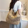 Bolsa de palha trançada vazada para mulheres, novo modelo 2026, bolsa de praia trançada de grande capacidade, estilo casual e descontraído, bolsa tote moderna