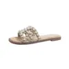 Pantuflas planas de concha de perla para mujer, para usar en el exterior en verano 2026, sandalias francesas de nuevo estilo, medias pantuflas de paja tejida para mujer