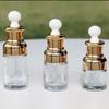 Frasco conta-gotas de óleo essencial transparente, frasco vazio de vidro de alta qualidade, cabeça de borracha, frasco de essência, solução de estoque de óleo essencial 20ml30ml40