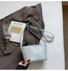 Bolsa Transfronteiriça Estilo Francês Cor Sólida Couro Macio Padrão Trançado para Mulheres, Primavera 2026 Bolsa de Mão e Bolsa Transversal Elegante Versátil Simples com Corrente