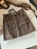 Falda vaquera de cintura alta estilo workwear retro para mujer, nueva colección otoño 2026, versátil, estiliza la figura y cuenta con múltiples bolsillos, falda corta de línea A