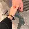 Pulsera para pareja nueva hecha de ojo de tigre amarillo natural y obsidiana plateada, un accesorio versátil de lujo ligero, un regalo para novia en el Festival Qixi