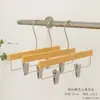Loja de roupas especial cabides pretos de acrílico femininos cabides plásticos infantis material de corda de algodão suporte de roupas antiderrapante clipe para pendurar calças atacado