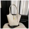 Bolso de cubo grande de moda estilo coreano 2026 transfronterizo para mujer, con un aspecto sofisticado, adecuado para el trabajo y los desplazamientos, y puede usarse como bolso de hombro para padres e hijos