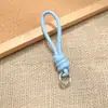 Bolsa de Corda de Couro PU Colorida Pingente Estilo Miu Simples Versátil Charme de Bolsa Chaveiro Acessório Lanyard de Celular Estilo Curto Novo