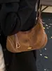 Bolsa Feminina Transfronteiriça Estilo Bolinho Feminina Versátil para o Dia a Dia Bolsa Transversal Bolsa Meia-Lua 2026 Nova Bolsa de Ombro em Camurça Bolsa de Axila